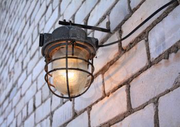 old torch on brick wall