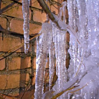 blue icicles near brick wall