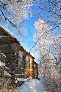 old rural house in snow