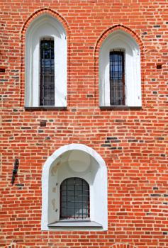 window in red brick wall