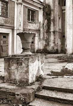 decorative urn near old buildings