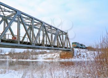 train on bridge through river 