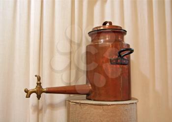 ancient copper teapot on stand