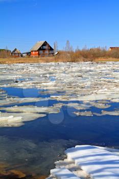 driving of ice on river near villages