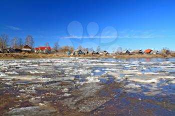 driving of ice on river near villages
