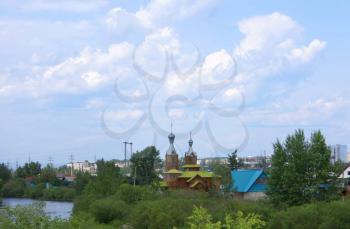 City of Chita, in the form of a wooden church, the river and high-rise buildings.
              