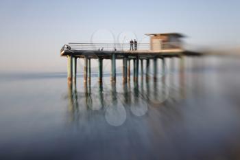 Pier in sea water. Soft focus. Made with lens-baby.