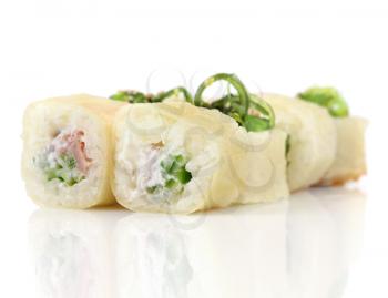 Sushi hot rolls with shrimp, cheese, tuna, wakame seaweed on white
