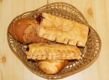 Basket with pie and bread on table