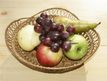 Much fresh fruits on table in basket