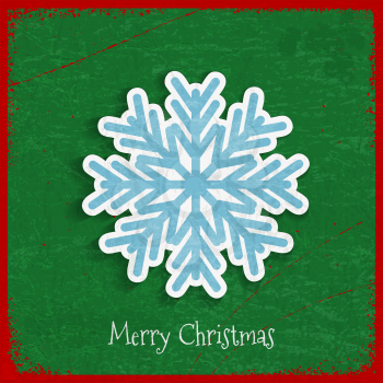 Paper snowflake on Christmas vintage background