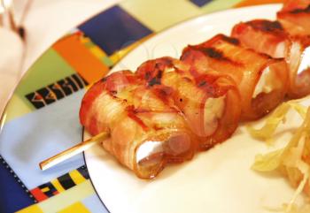 Close-up image of bacon rolls with cheese