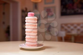 Tower of macaroons on a beautiful vintage table.