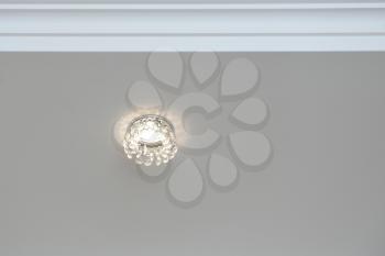 Beautiful ceiling light set in white ceiling.