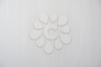 Beautiful cream wallpaper on the wall with a wood texture.
