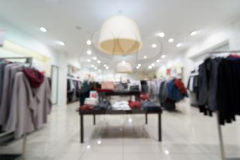 Beautiful blurred background of a women's clothing store in a mall.