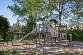 Children's slide made of wood on a children's playground