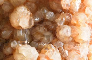 Gemstone Artichoke quartz and its texture, transparent, with an orange tint.
