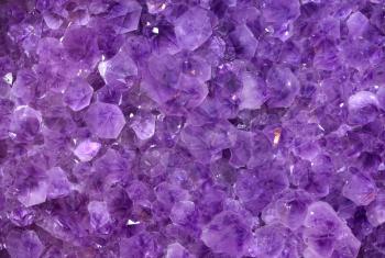 Gemstones amethyst bright purple, texture of stone. Beautiful surface of amethyst stones