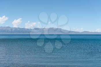 Calm surface of the lake with a sunny day. Shot in Sayram Lake, Xinjiang, China.