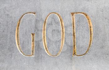 God written in golden font in stone