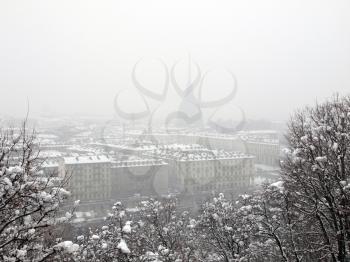 City of Turin (Torino) skyline panorama seen from the hill - winter view with snow