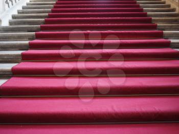 Red carpet on a stairway used to mark the route on ceremonial and formal occasions or events