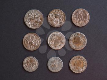 Ancient Roman and medieval coins over black background