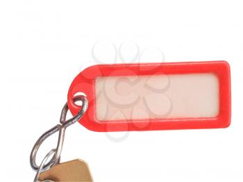 Red plastic keyring with label isolated over white background