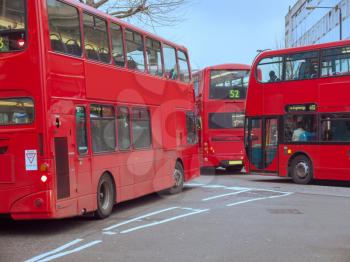 Red Double Decker Buses in a busy street in Notting Hill London UK