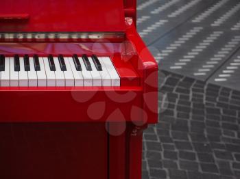 details of a red piano keyboard keys