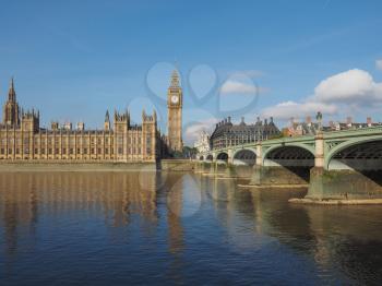 Houses of Parliament aka Westminster Palace and Westminster Bridge over River Thames in London, UK