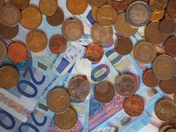 Euro (EUR) banknotes and coins, currency of European Union (EU) useful as a background