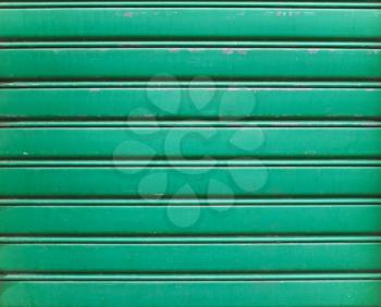 green metal texture of rolling shutter useful as a background