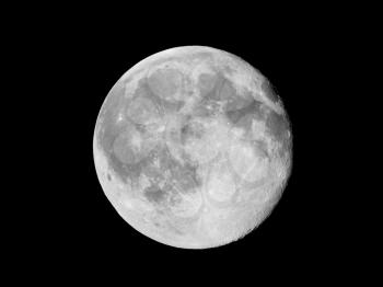 Full moon over dark black sky seen with a telescope from northern emisphere at night