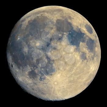 Full moon seen with an astronomical telescope, with enhanced colours to show the real colours of terrain surface