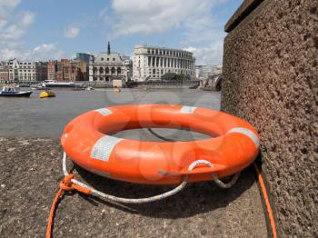 A life buoy on River Thames bank, London