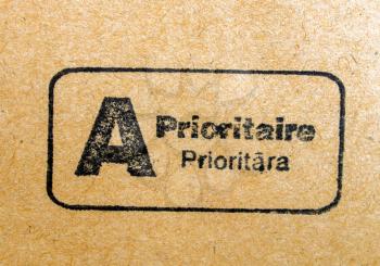 International priority mail postmark on a letter envelope written in French and Latvian