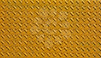 Yellow steel diamond plate useful as a background