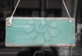 Blank sign in a shop window with reflections and copy space