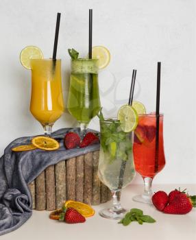 Fruit juice cocktails on a wood stump