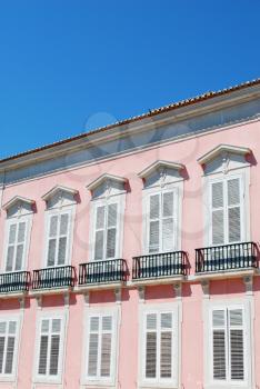 Royalty Free Photo of a Pink Residential Building