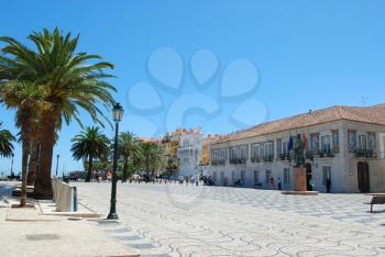 Royalty Free Photo of a Building and Palm Trees in Cascais, Portugal