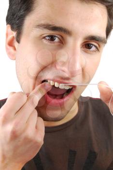 Royalty Free Photo of a Man Flossing