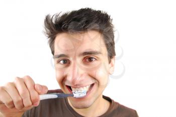 Royalty Free Photo of a Man Brushing His Teeth
