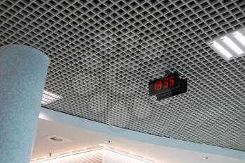 Royalty Free Photo of an Indoor Ceiling With a Digital Clock at the Airport