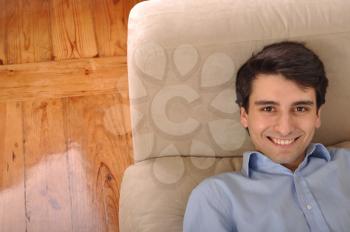 Royalty Free Photo of a Man Relaxing on a Couch