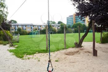 A small cable swing at a park playground for children