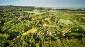 drone shot of large camping site in a forest