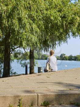 Woman sitting at the lake